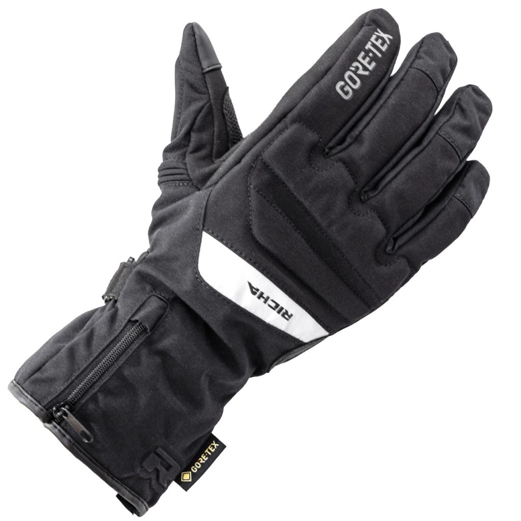 Black motorcycle gloves with Gore-Tex technology, designed for protection and comfort in all weather conditions.